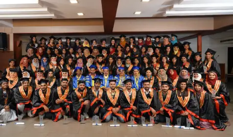 Optometry batch students in graduation robes and caps, celebrating their completion at Abate Institution