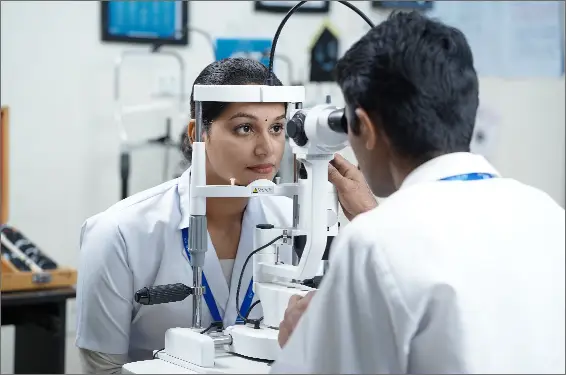 Ophthalmology students in a lab conducting an eye examination